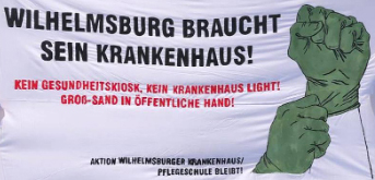 Transparent mit der Aufschrift: Wilhelmsburg braucht ein Krankenhaus