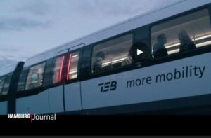 Waggon einer Magnetschwebebahn. Bezeichnung TEB more mobility.Unten rechts steht Hamburg Journal